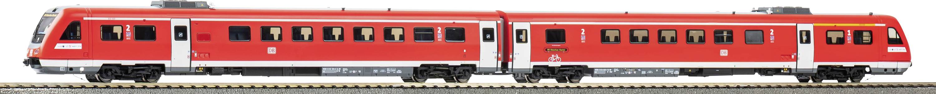 A red passenger train with two cars on a track, featuring large windows and visible wheels, against a plain background.