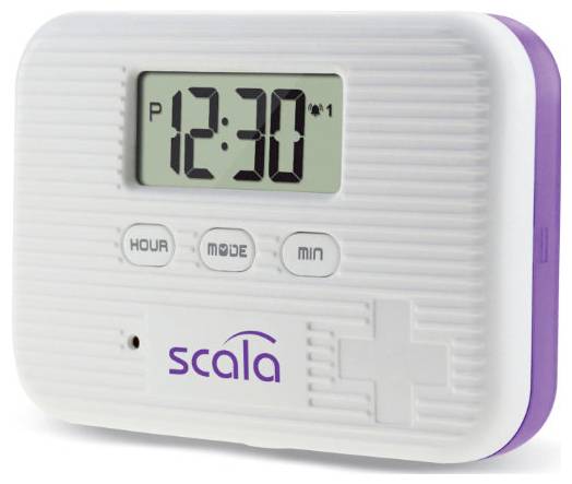 'Scala' pill reminder device displaying time 12:30 with buttons for hour, mode, and minutes.