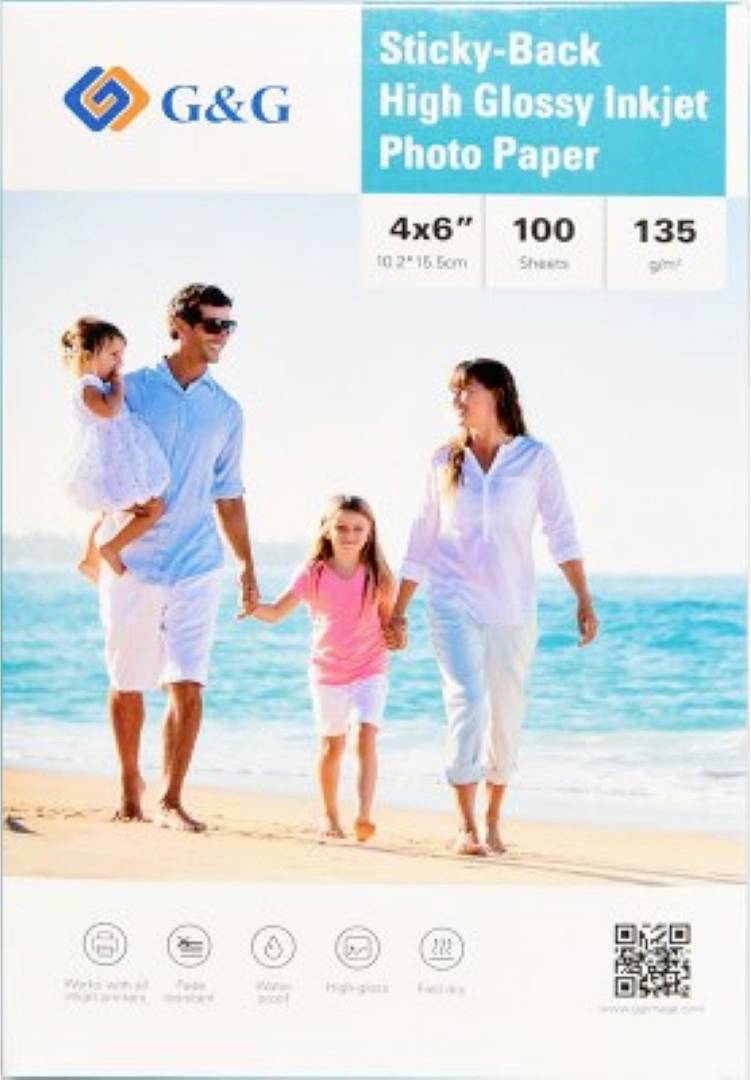 A family of four walks on a sunny beach, representing usage of 'G&G Sticky-Back High Glossy Inkjet Photo Paper, 4x6'', 100 sheets, 135 gsm'.