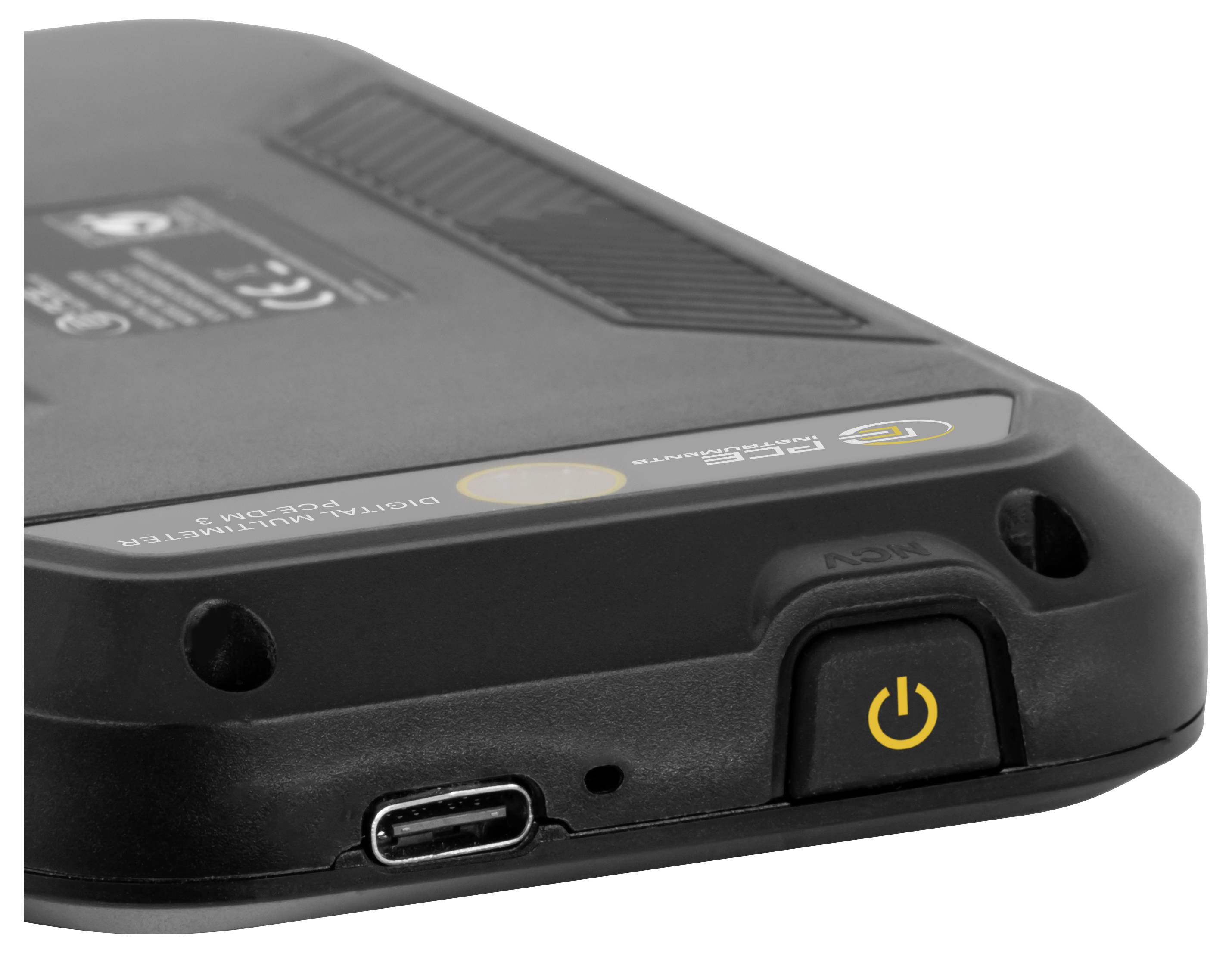 Close-up of a black electronic device corner with a USB-C port and yellow power button on a white background.