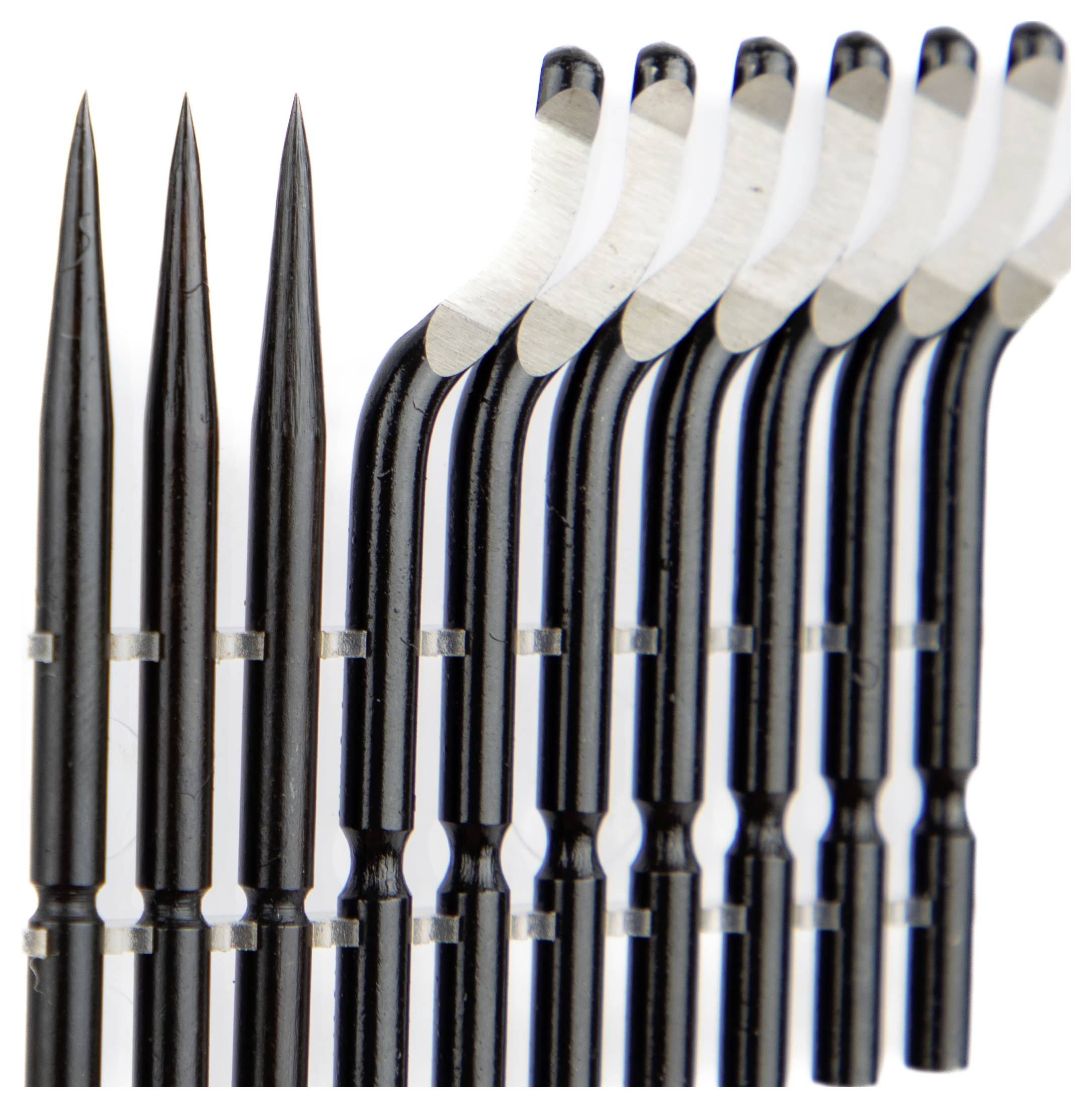 A row of metal precision tools with pointed and hooked ends, likely used for detailed crafting or modeling work.