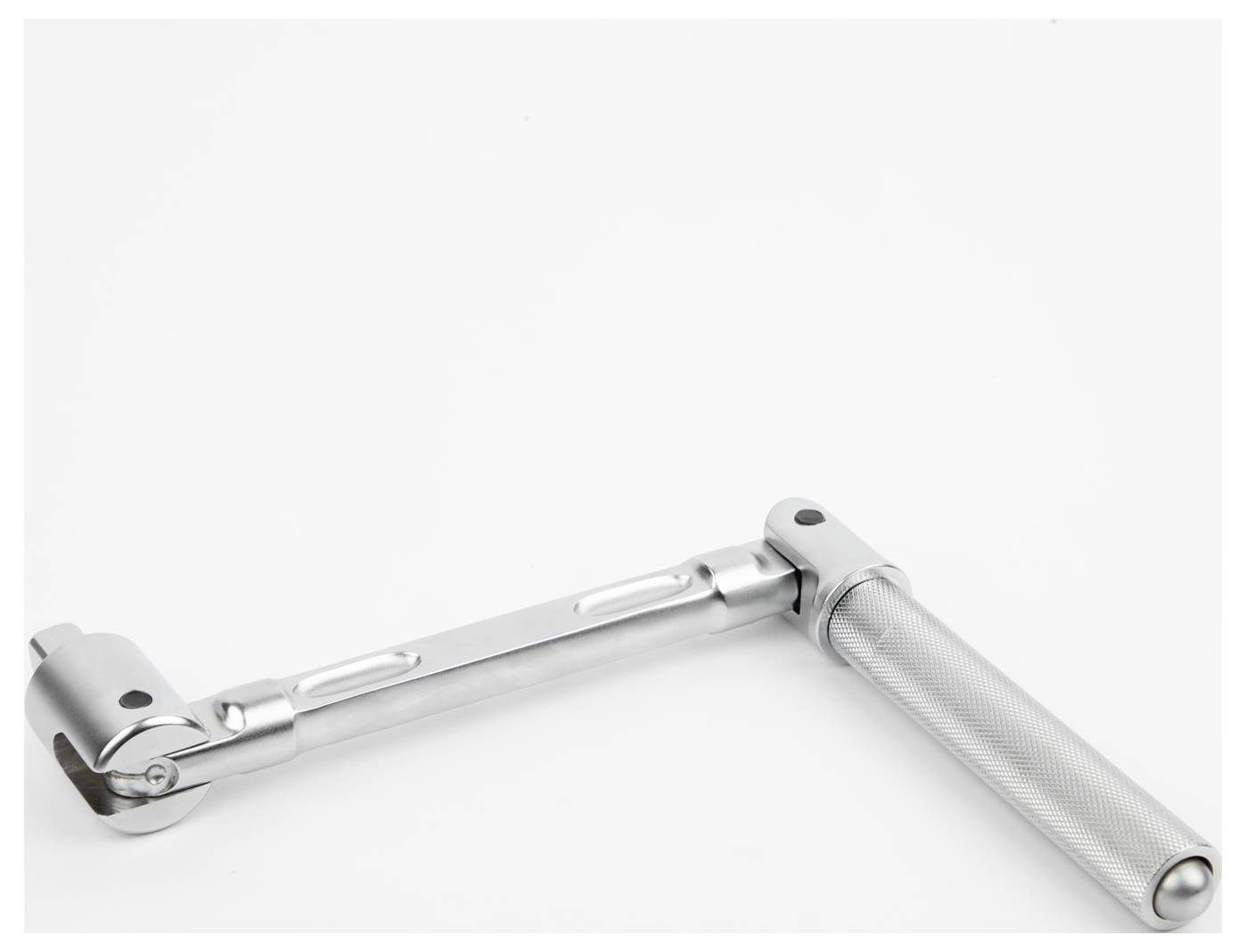 A silver metal adjustable wrench, positioned on a plain white background, showcasing its rotating joint and textured handle.