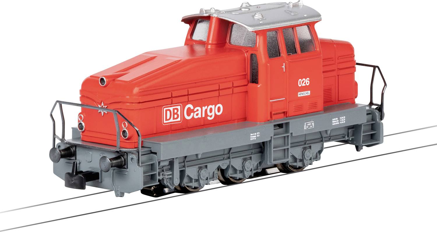 A red model freight train engine labeled 'DB Cargo' on a white background, illustrating a freight train transportation theme.