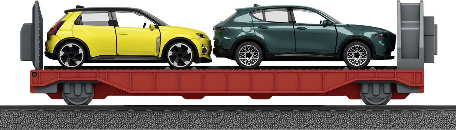 Two cars, one yellow and one green, are loaded on a flatbed railcar with a red base, viewed from the side on railroad tracks.