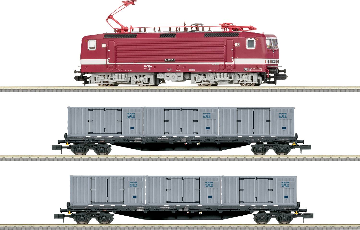 A red locomotive pulls two blue freight cars on parallel tracks.