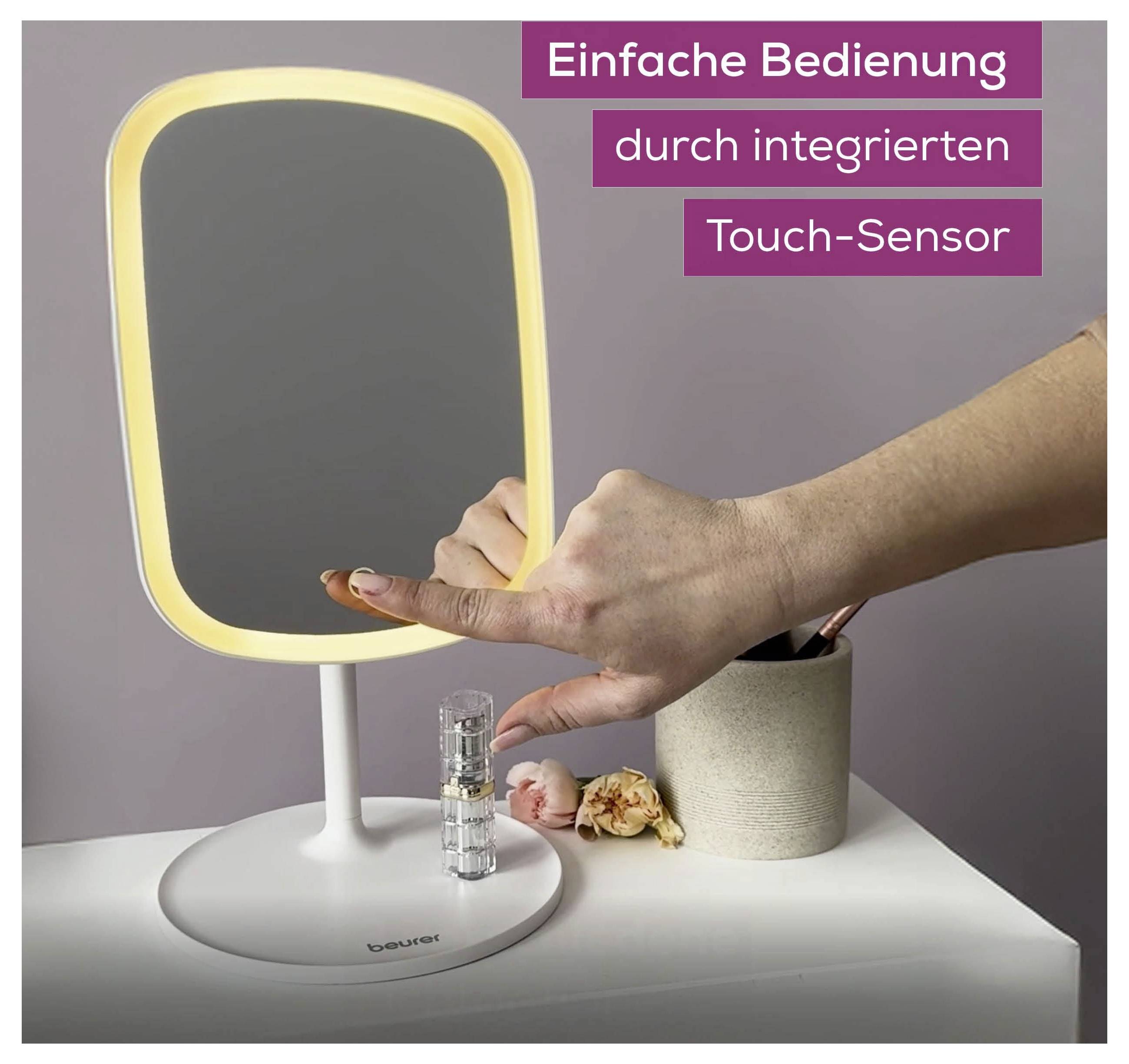 A person demonstrates the touch-sensor feature on an illuminated makeup mirror. German text highlights easy use via the 'Touch-Sensor'.