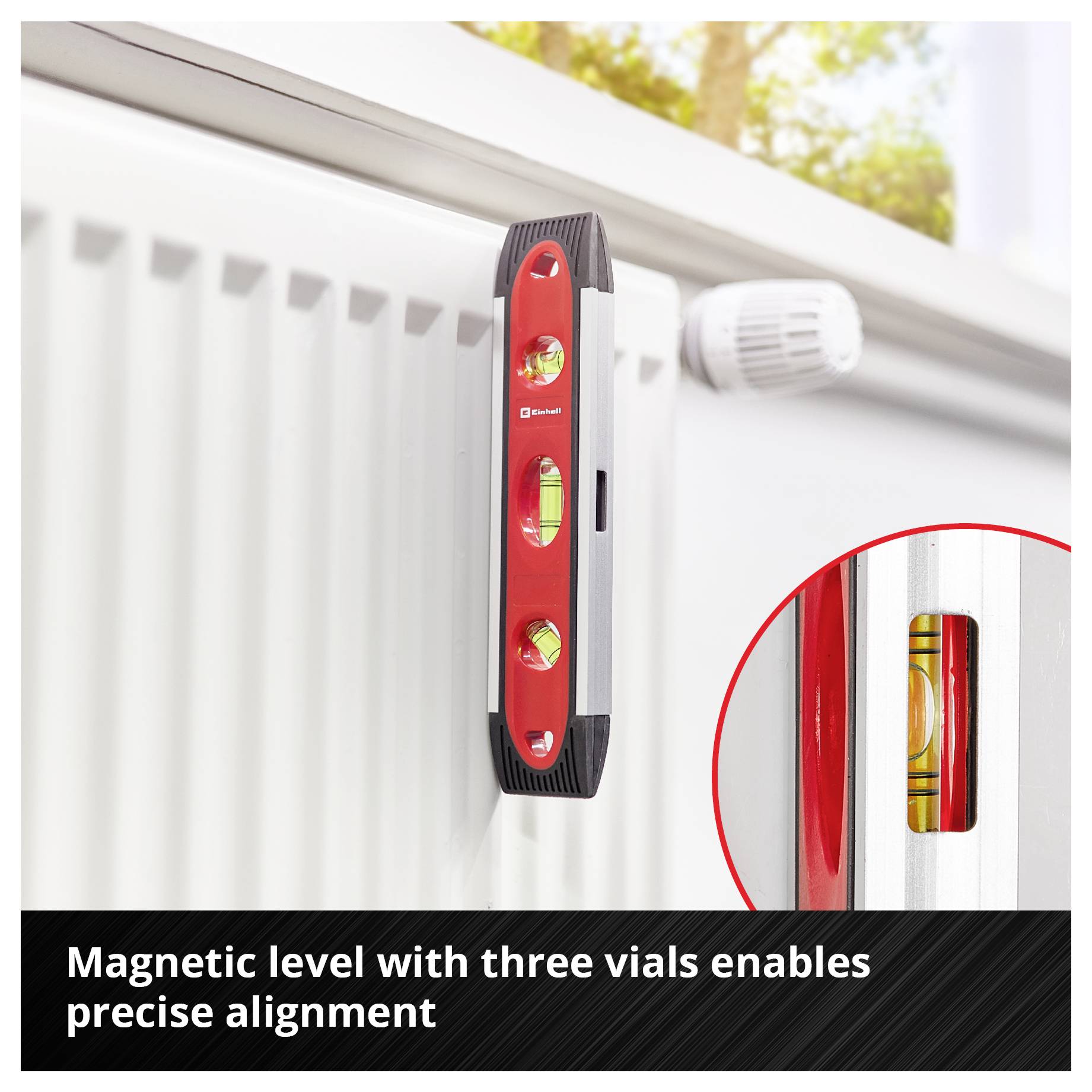 Magnetic spirit level with three bubble vials is attached to a radiator and ensures precise alignment.