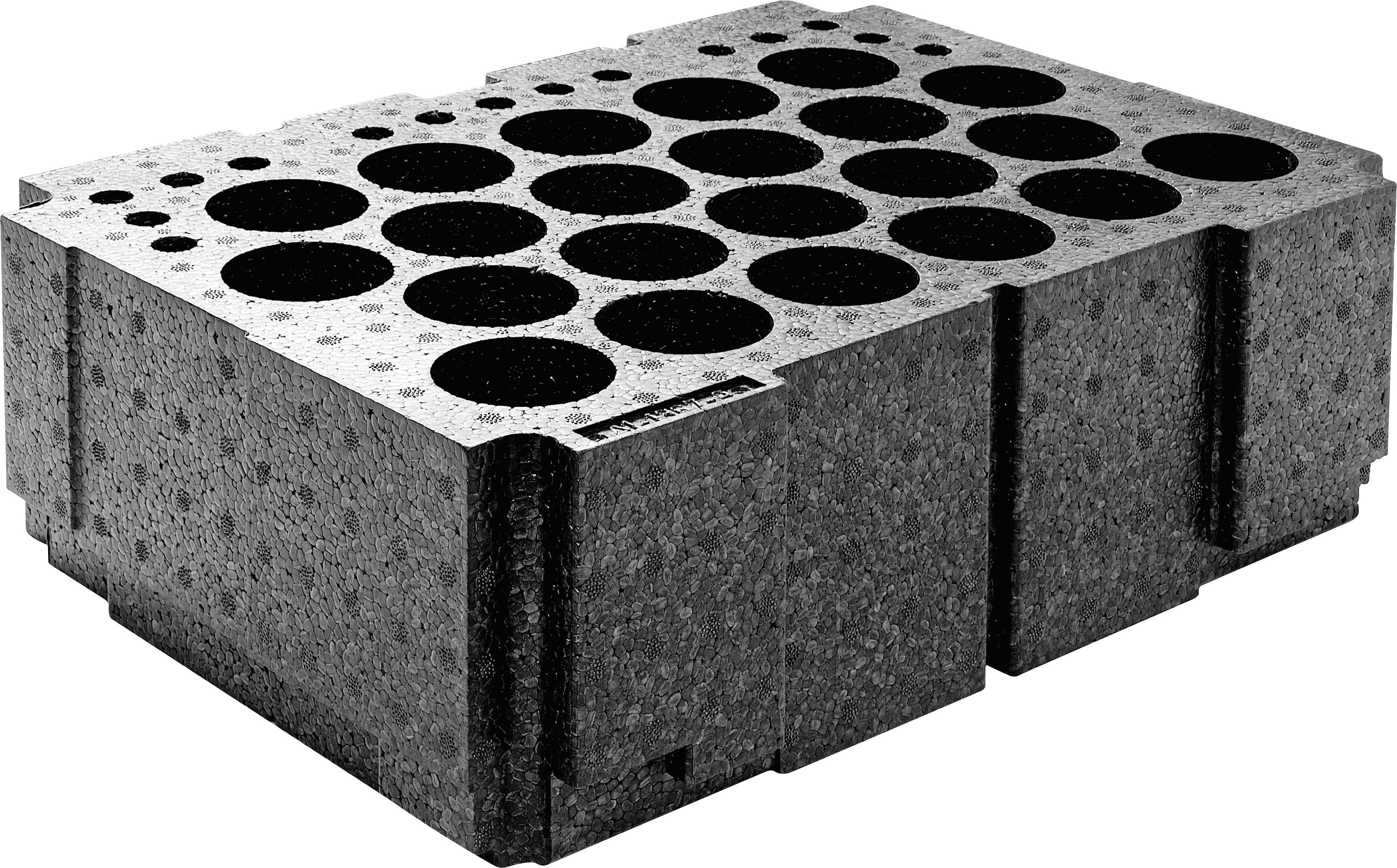 A rectangular cinder block with multiple large circular holes on the top surface, typically used in construction for building walls.