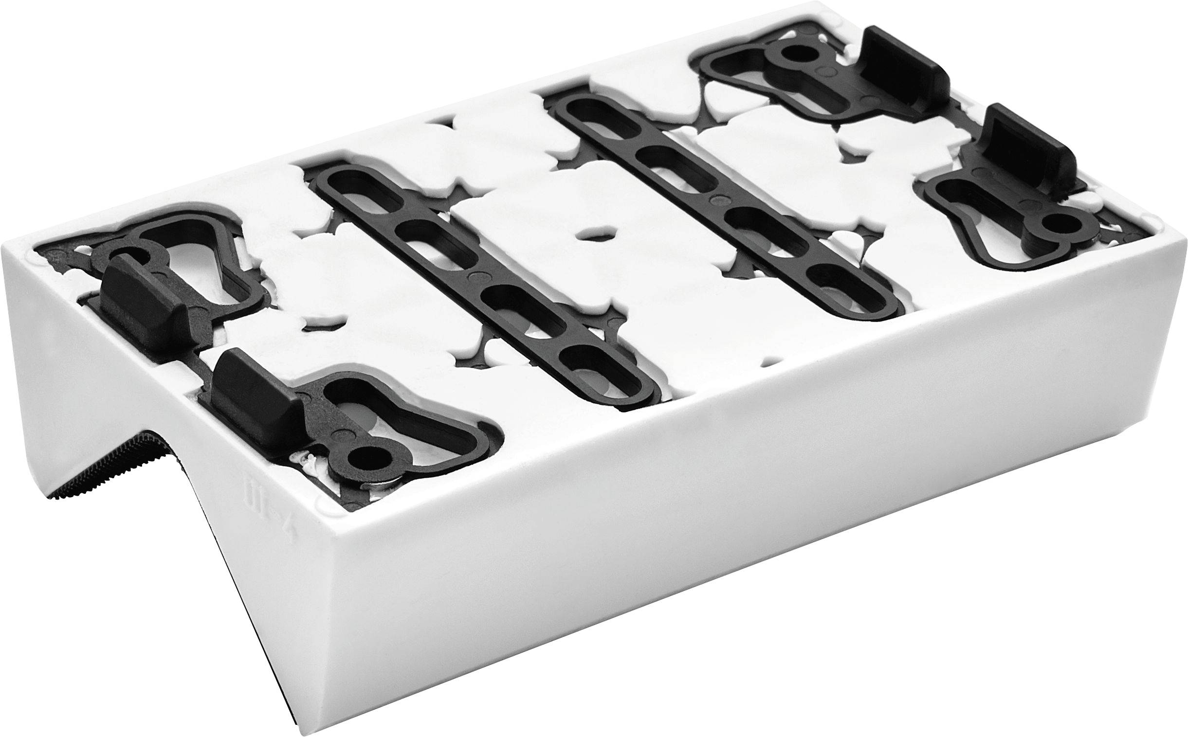 A white and black plastic module with slots and brackets on top, designed for customizable arrangements or configurations.