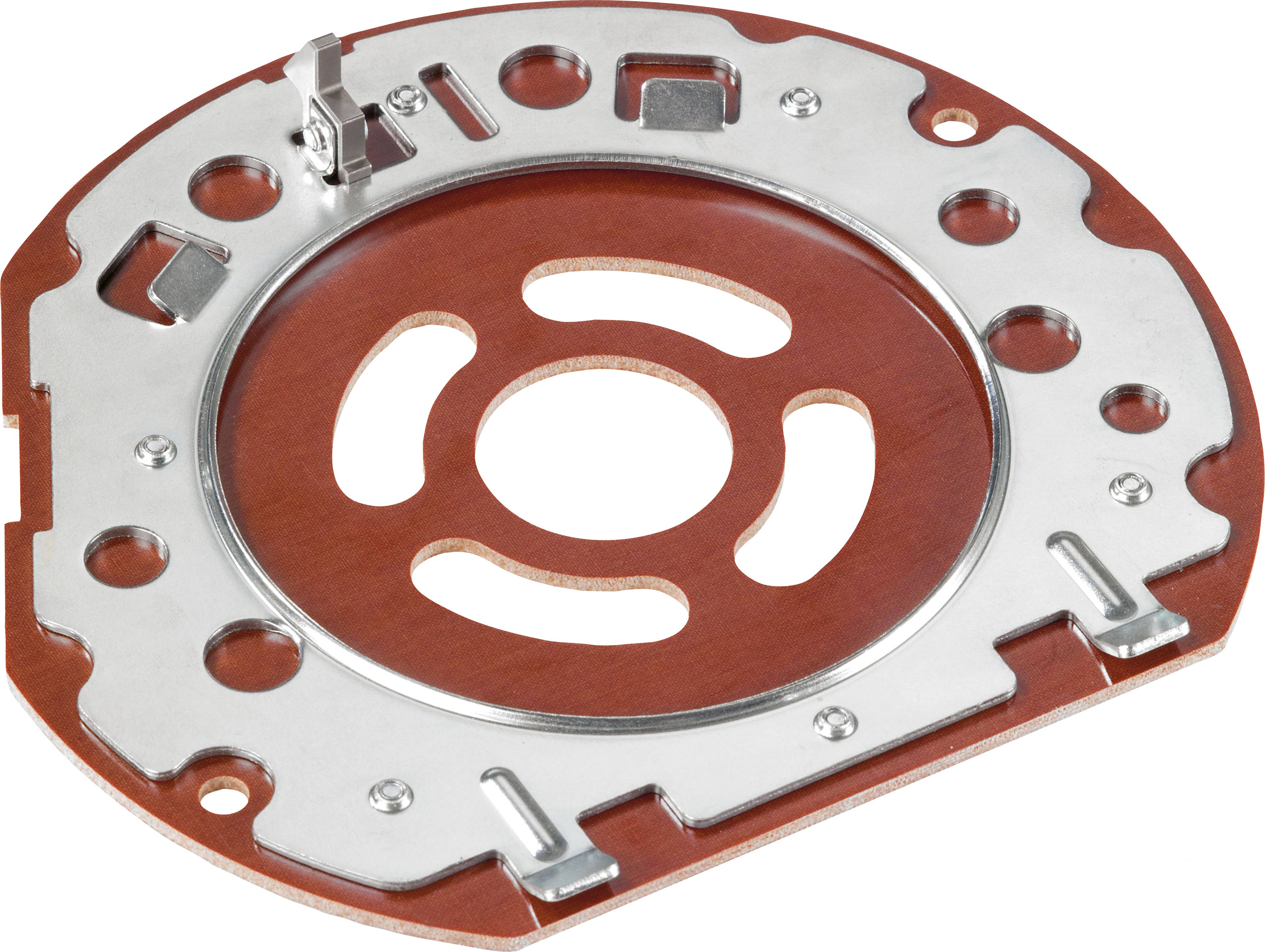 A circular metal and brown composite plate with various cutouts and attachment points, possibly part of an industrial mechanism or device.