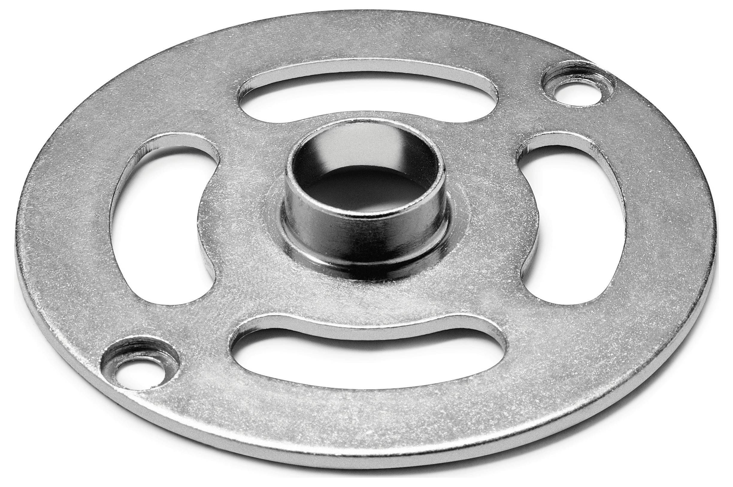 A circular metal steering wheel spinner adapter with three elongated holes and a central cylindrical opening, used for enhanced grip.