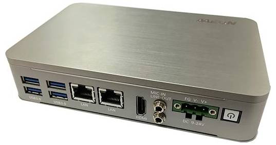 A compact silver device with multiple ports: four USB 3.0, two LAN, HDMI, mic/line-in, audio out, and power button; used for audio-visual connectivity.