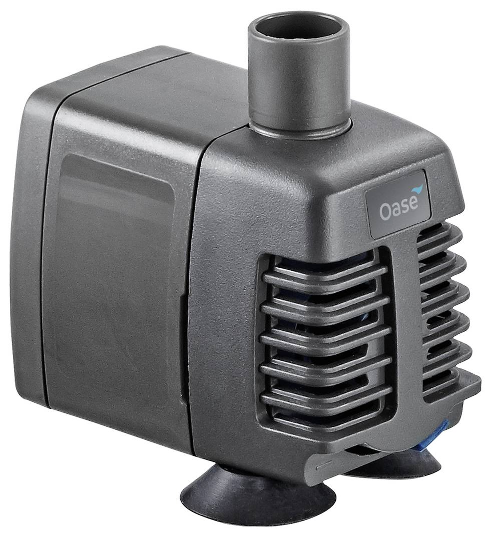 Compact black Oase water pump with top outlet and front intake grilles, shown on suction feet against a white background.