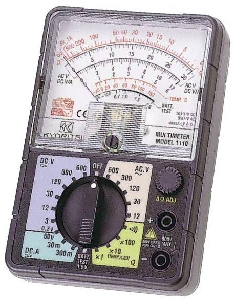 Analog multimeter displaying various measurement options on its dial, including DC voltage, AC voltage, and resistance.