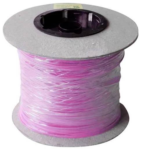 Spool of pink filament for 3D printing.