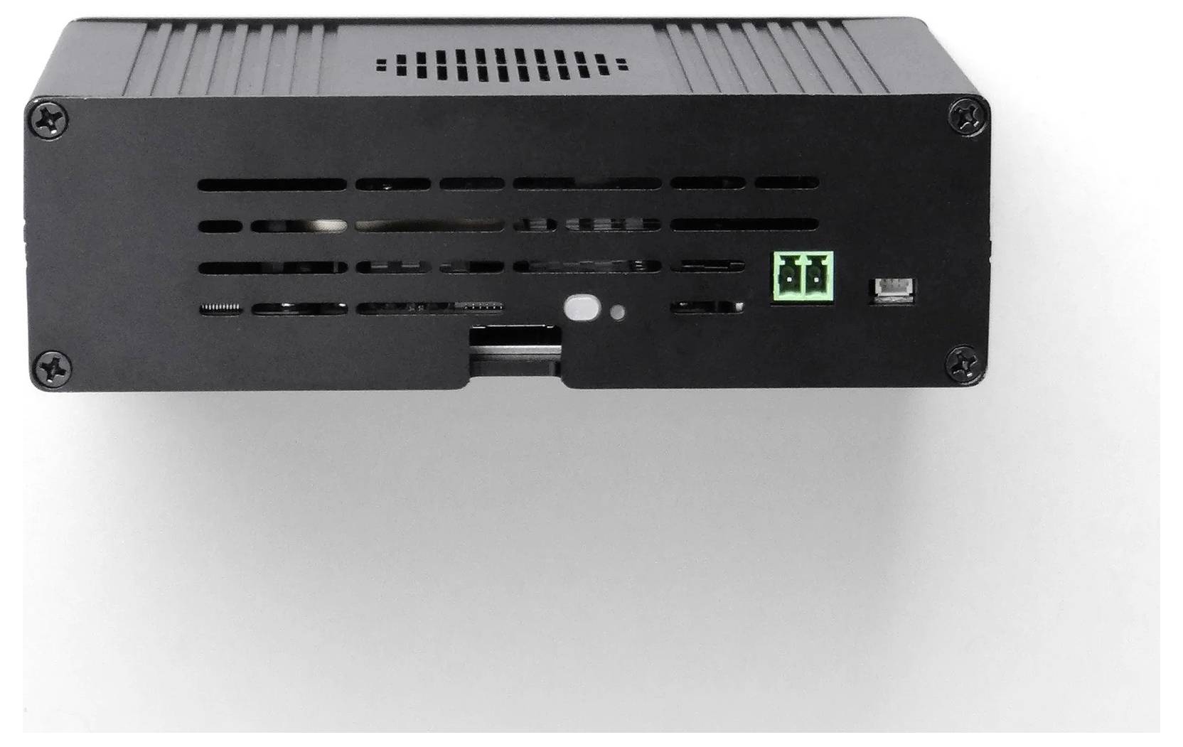A black rectangular electronic device with vents and visible screws, and two small green connectors on the front.