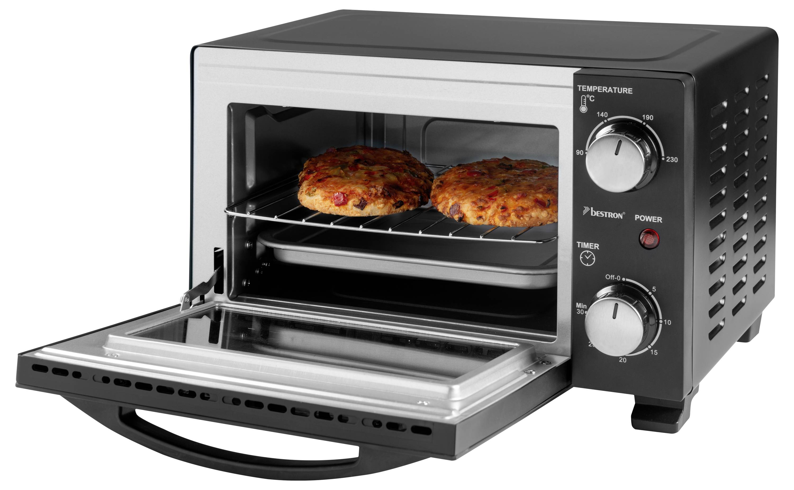 Two pizzas baking inside a black toaster oven with temperature and timer dials on the right side.