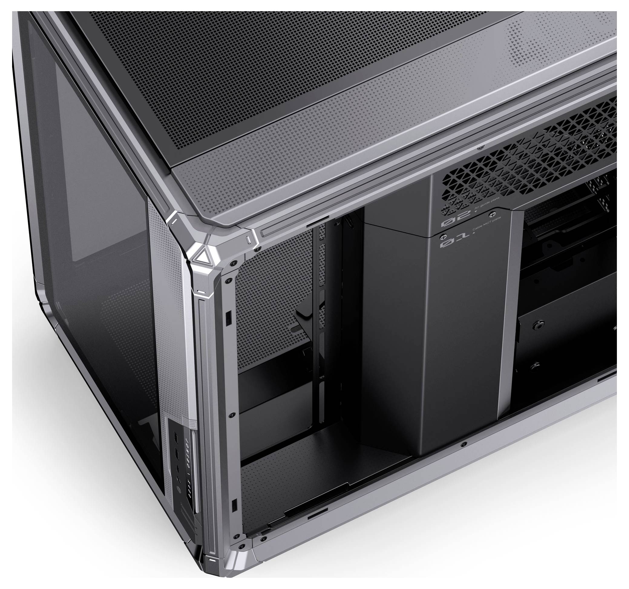 A partially assembled computer case with a metallic finish, revealing internal compartments for hardware installation.