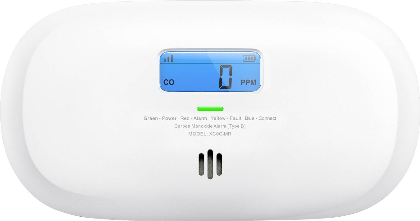 A carbon monoxide alarm showing 'CO 0 PPM' on a digital display, indicating no carbon monoxide detected. Green power light is on.