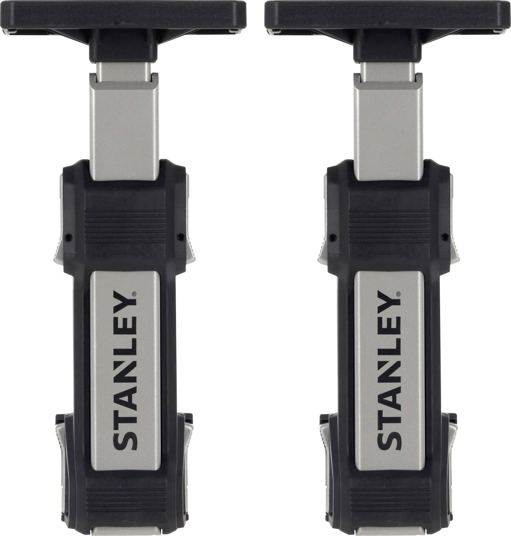 Two black and silver Stanley folding sawhorses with sturdy, extendable legs, featuring the Stanley logo on the front.