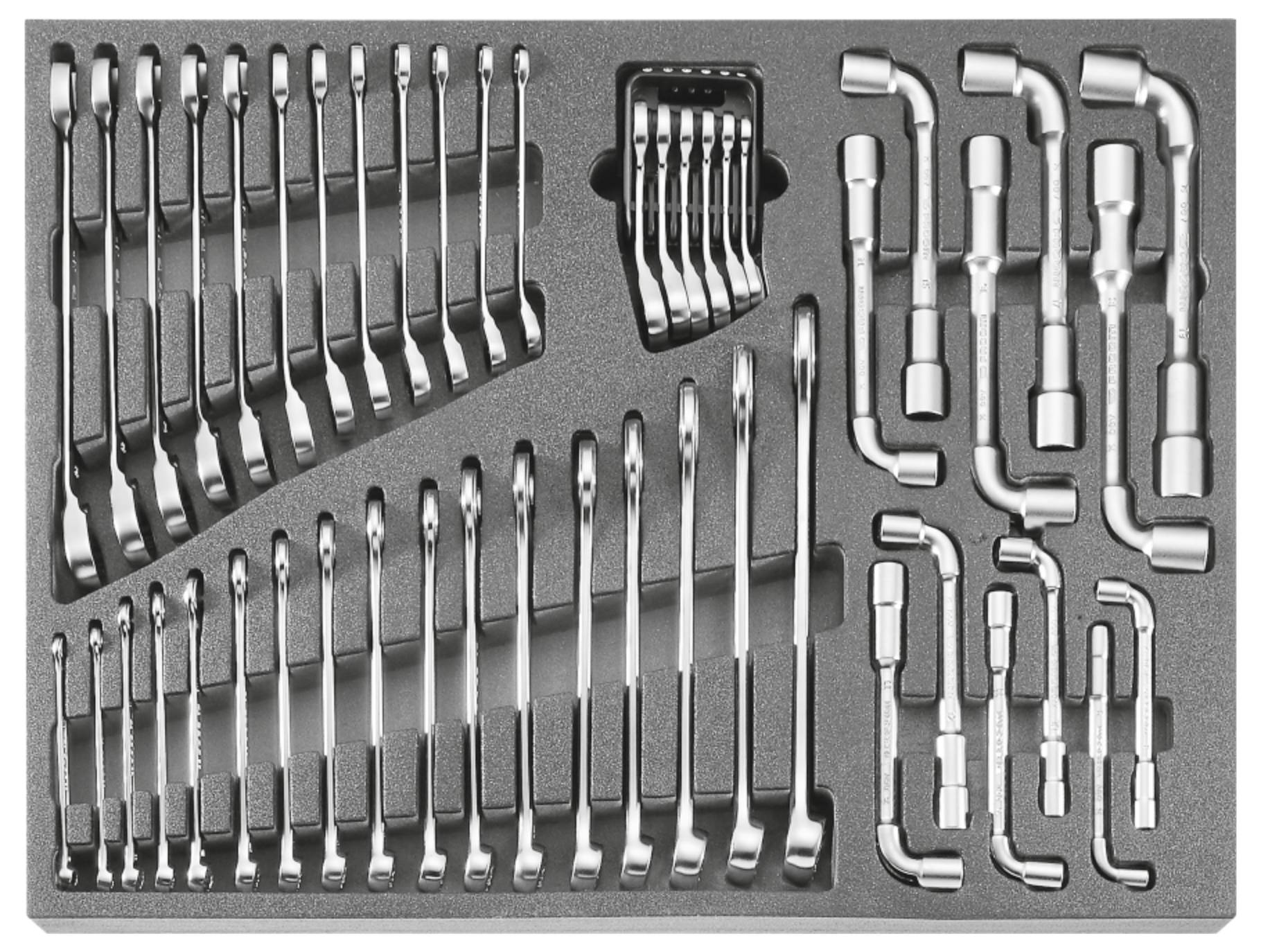 Foam organizer tray holding assorted metal wrenches and socket tools arranged in labeled cutouts.