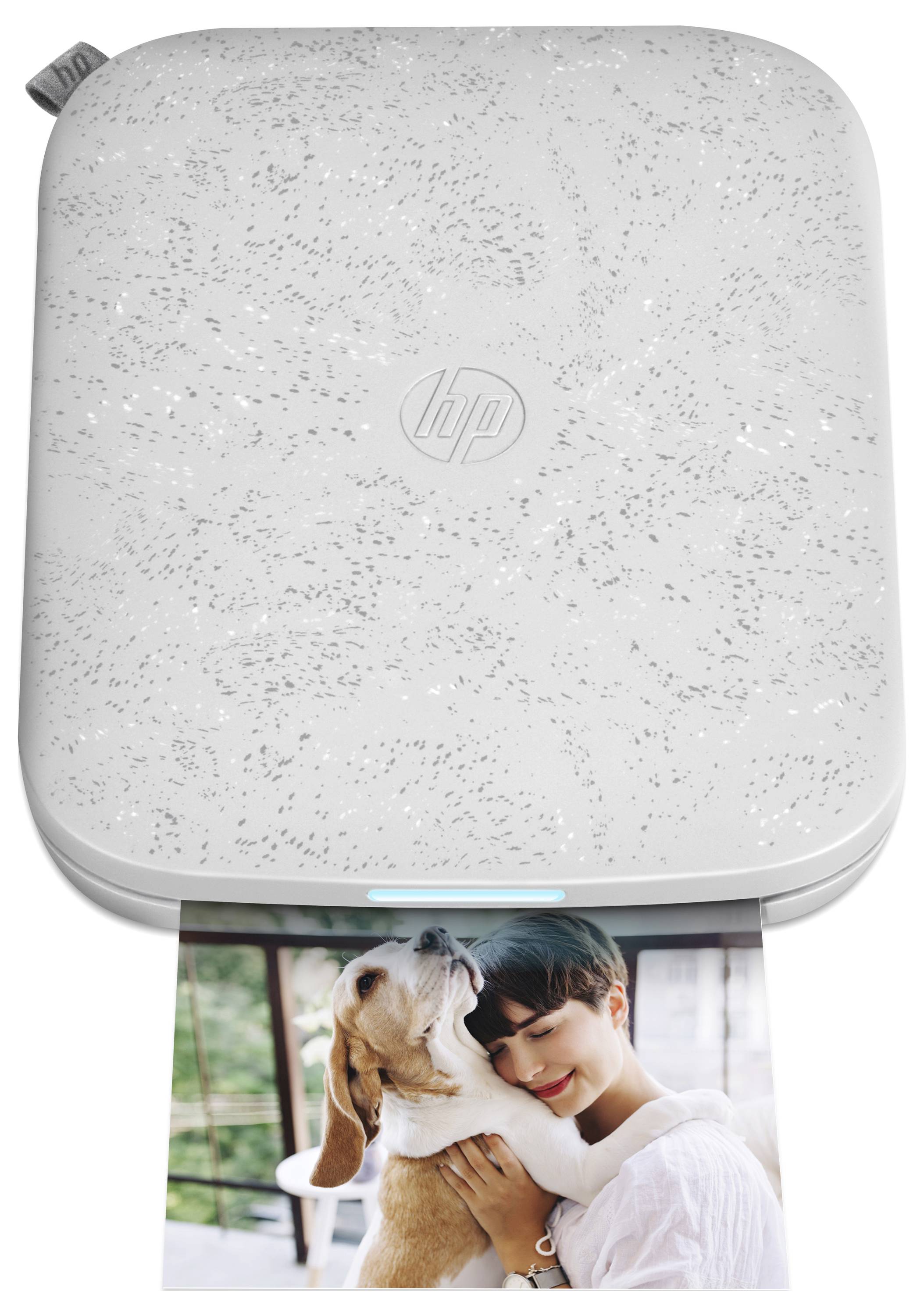 White HP portable printer printing a color photo of a woman hugging a dog