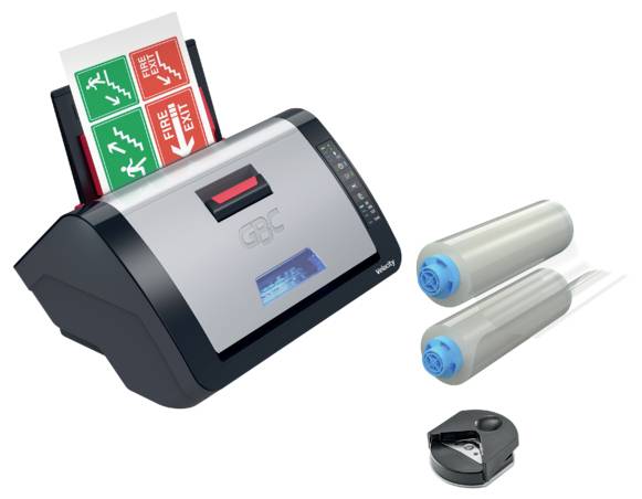 A laminator with ID cards being fed in, two laminated rolls on the right, and a small black punch tool below.