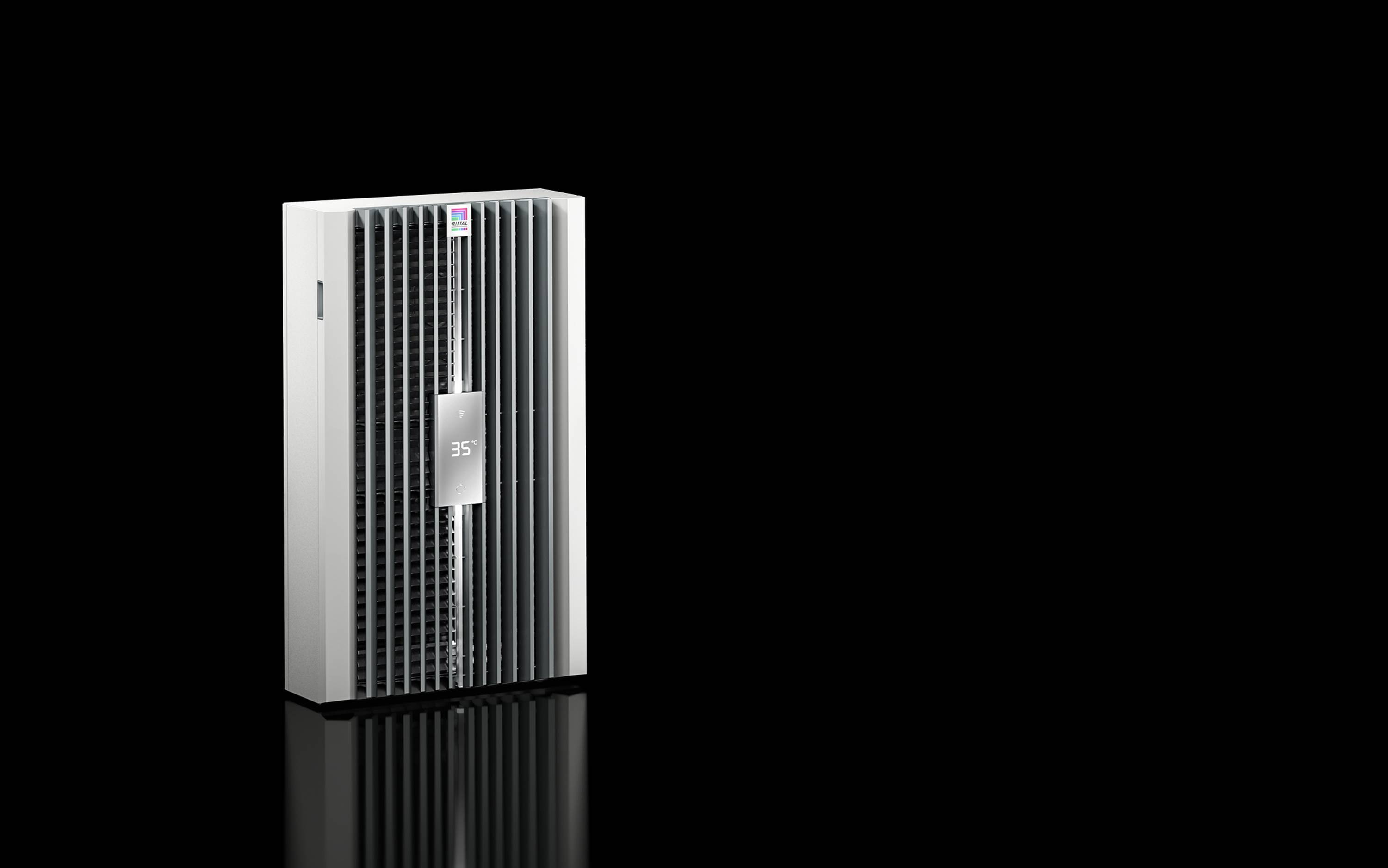 A silver rectangular air purifier with vertical front vents and a small central control panel, shown on a black background with a reflection below.