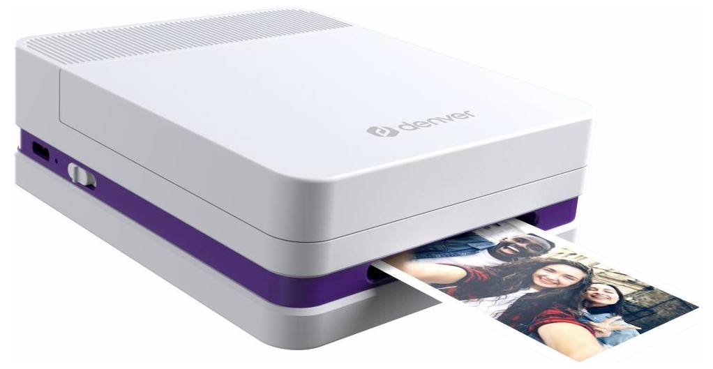Compact photo printer printing a color photo of smiling people, with a white and purple body on a plain background.