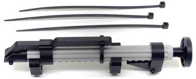 Black plastic cable tie tensioning and cutting tool with three loose zip ties above it on a white background.