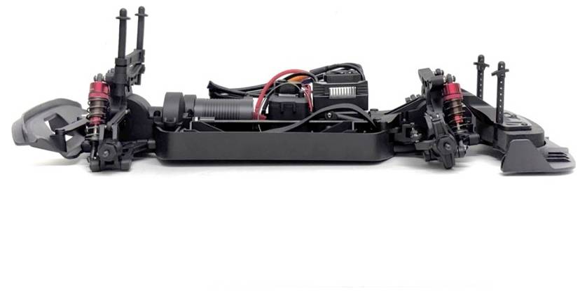 Bare chassis of a remote-controlled car, showing exposed frame, suspension, shocks, motor, and wiring on a white background.