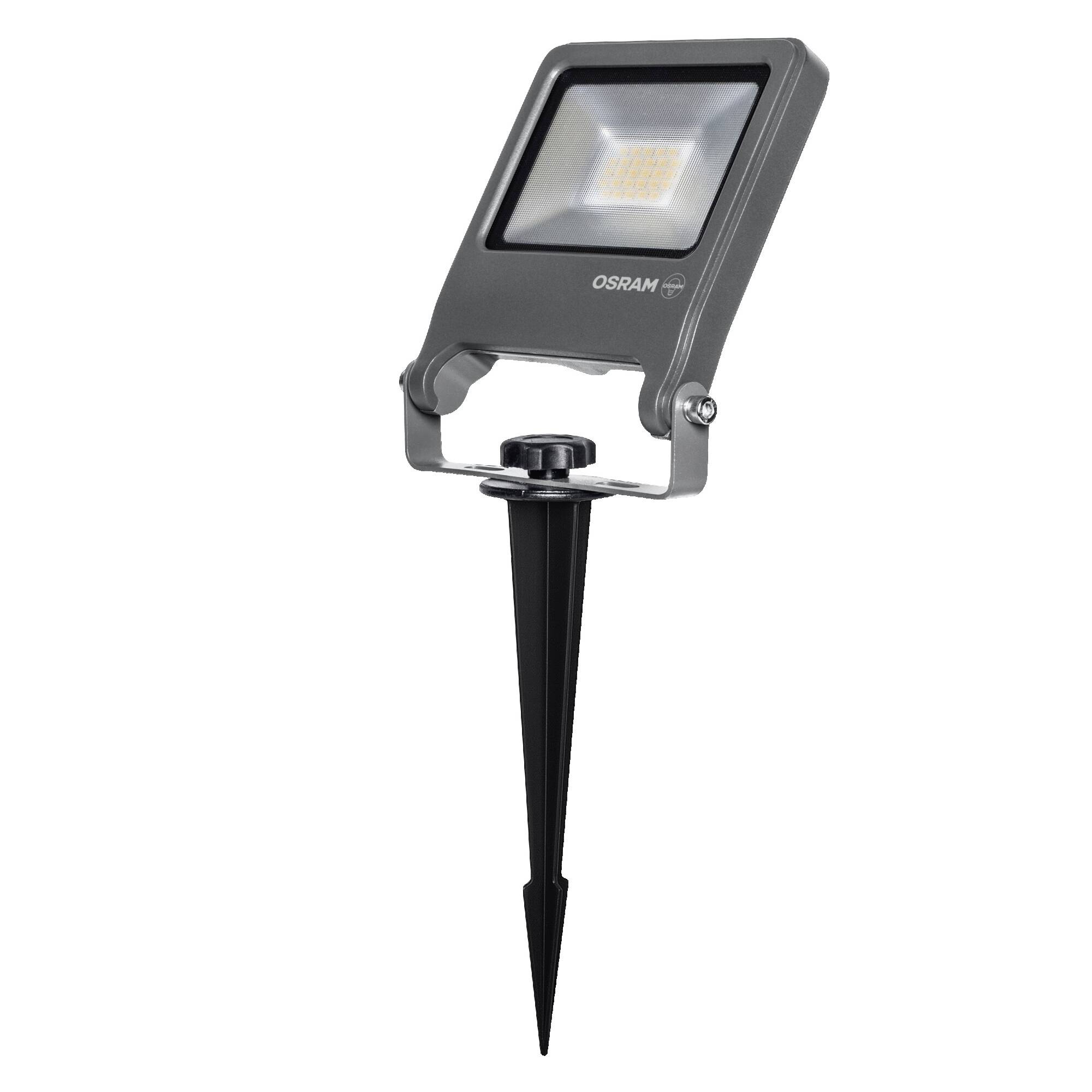 Black OSRAM LED spotlight on a ground stake for outdoor landscape lighting.