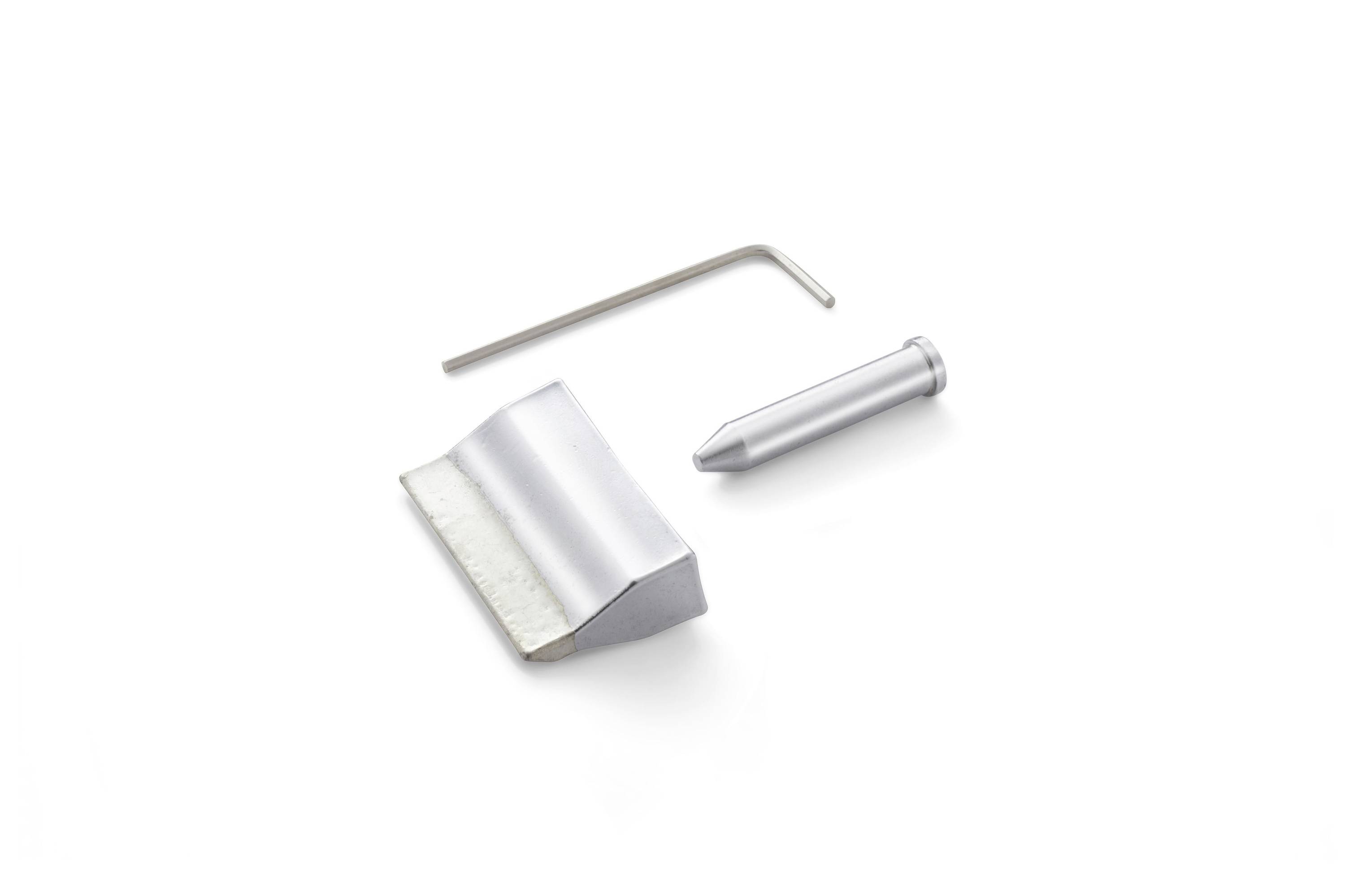 Three metal parts on a white background: an L-shaped hex key, a pointed pin, and a curved sheet metal clip.