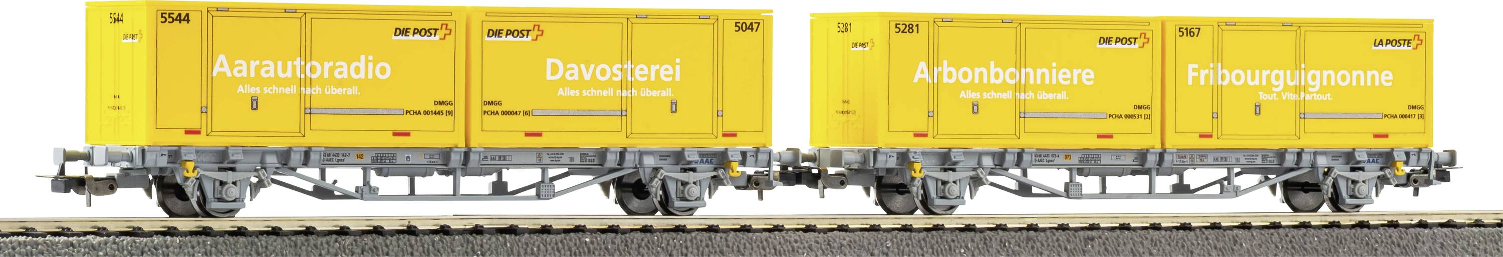 Yellow freight rail cars carrying container units labeled 'Arautoradi', 'Davosterei', 'Aibonbonniere', and 'Fribourgignon'.