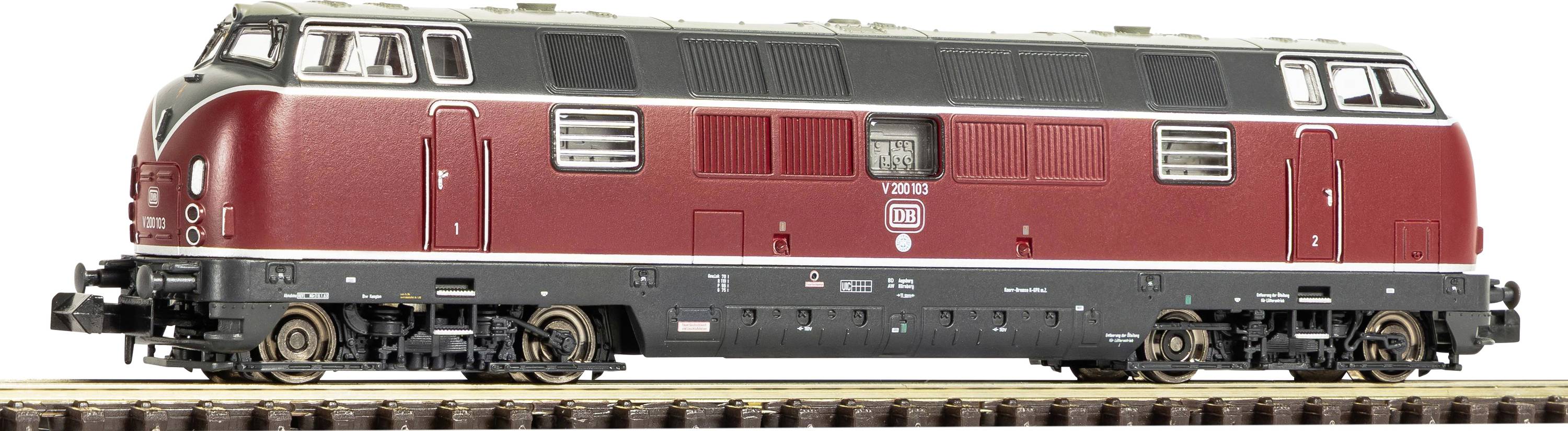 Side view of a red diesel locomotive on train tracks, shown in profile on a white background.