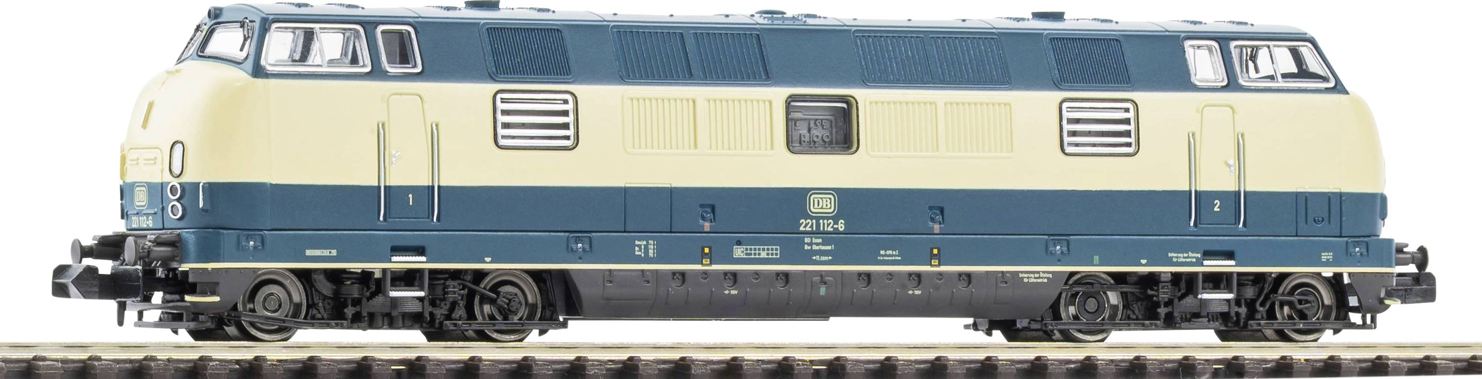 Side view of a blue and cream diesel locomotive on tracks, shown against a white background.
