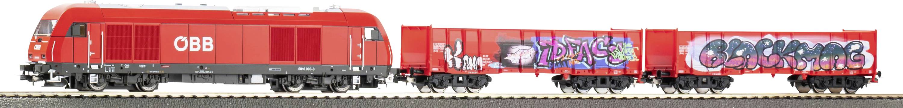 Red ÖBB freight train cars with graffiti artwork on the sides, shown in a side view on a white background.