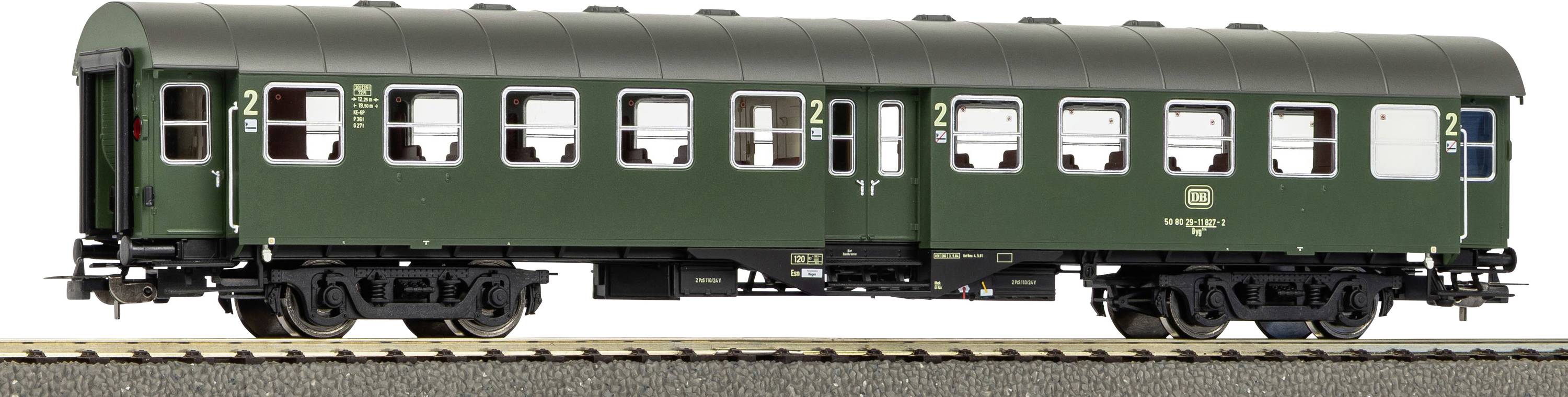 Side view of a dark green passenger train car with numbered compartments and windows on tracks.