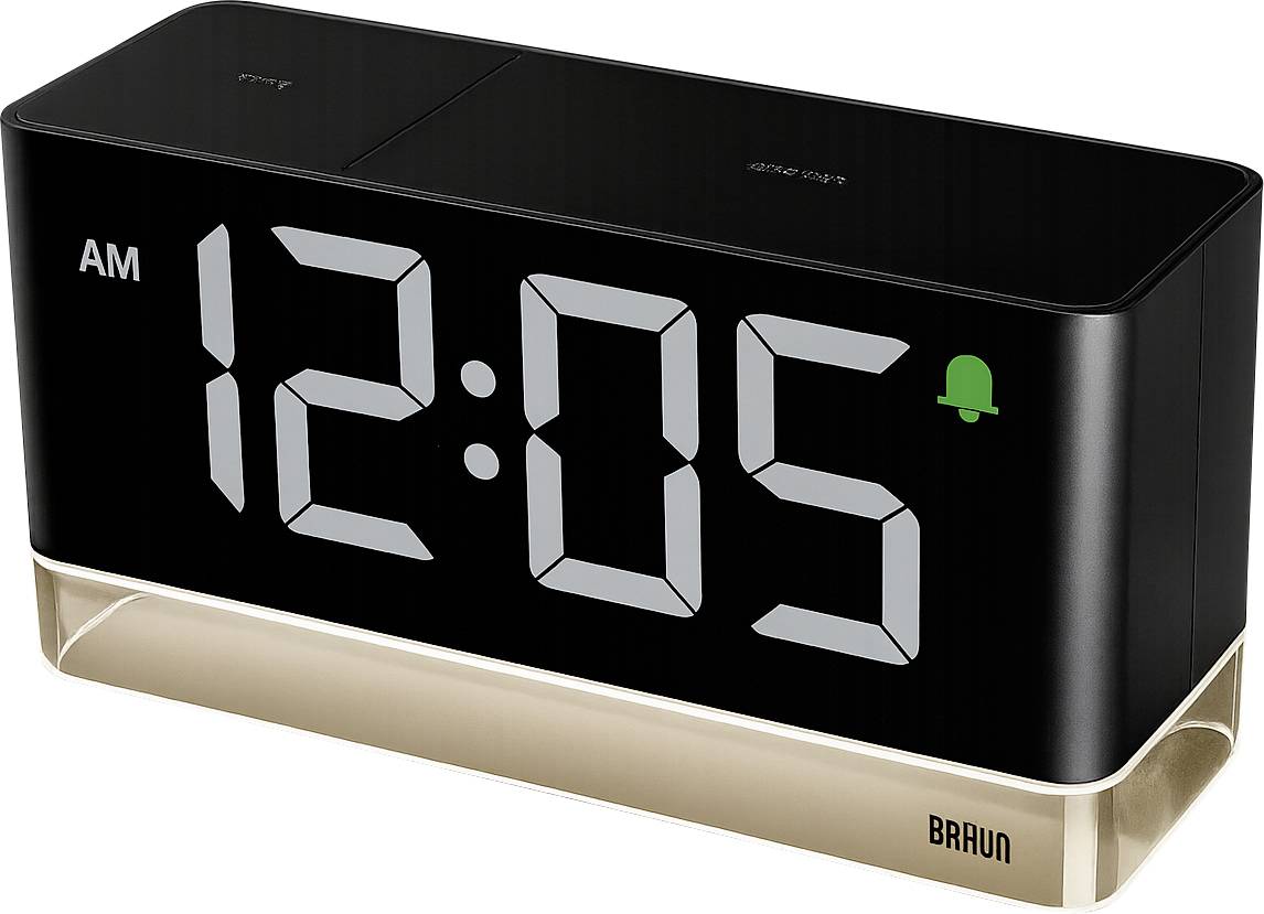 Black Braun digital alarm clock showing 12:05 AM with a green alarm icon, on a gold base.