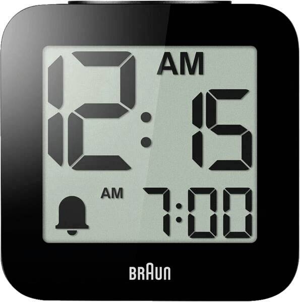 Digital Braun alarm clock showing 12:15 AM, with alarm set for 7:00 AM.