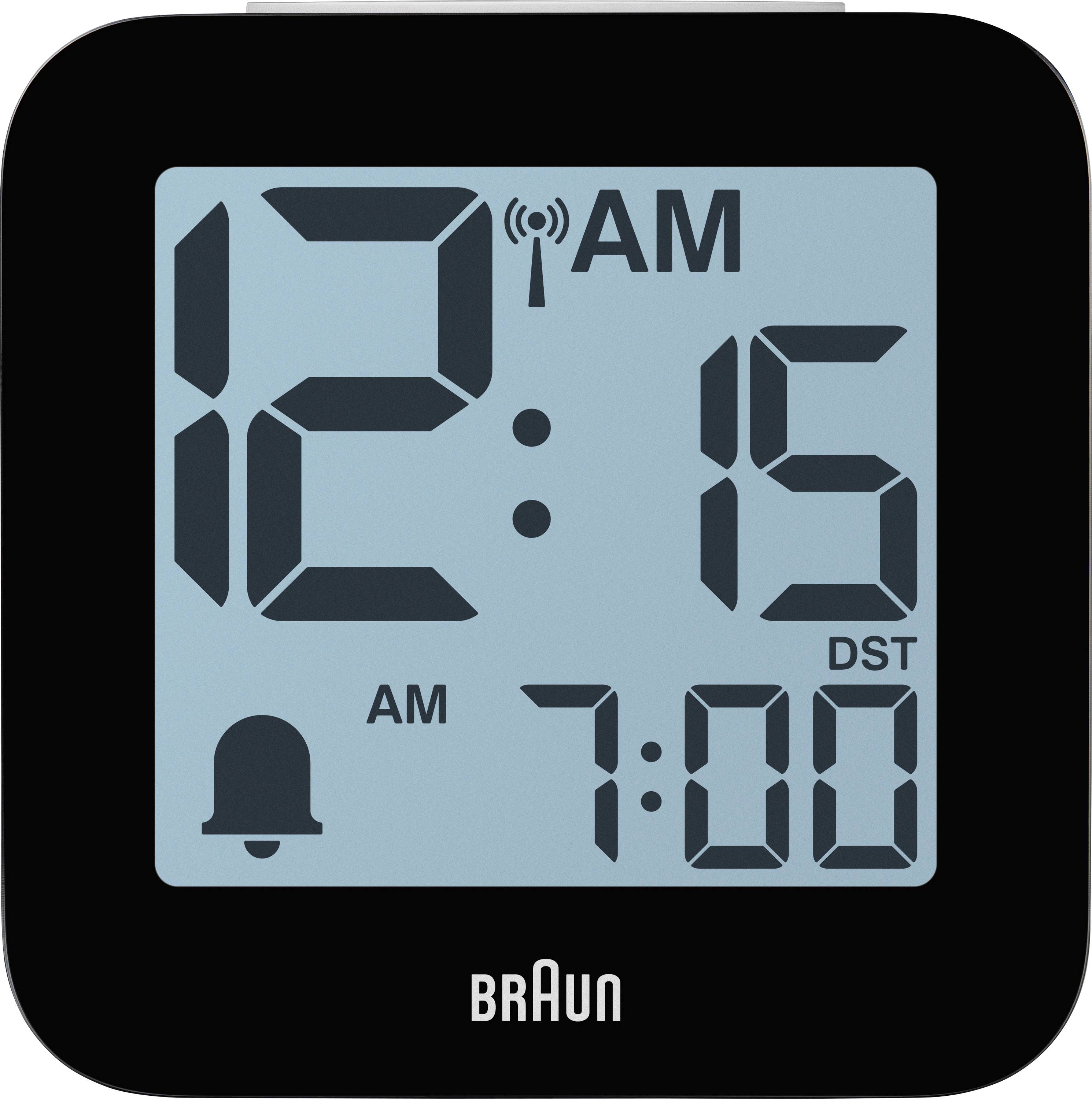 Black Braun digital alarm clock display showing 12:15 AM, alarm set for 7:00, with DST indicator and bell icon.