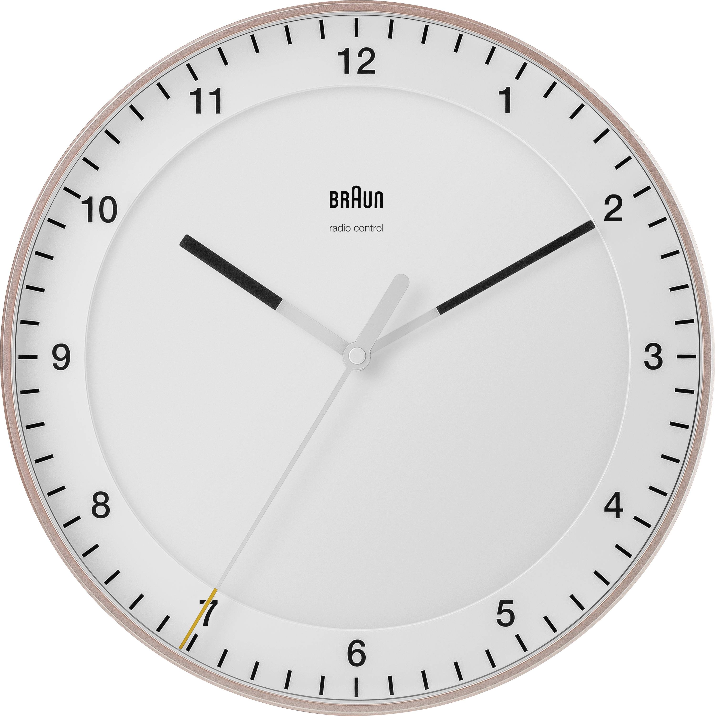 A minimalist white Braun analog wall clock with black numbers and hands, showing about 10:10.