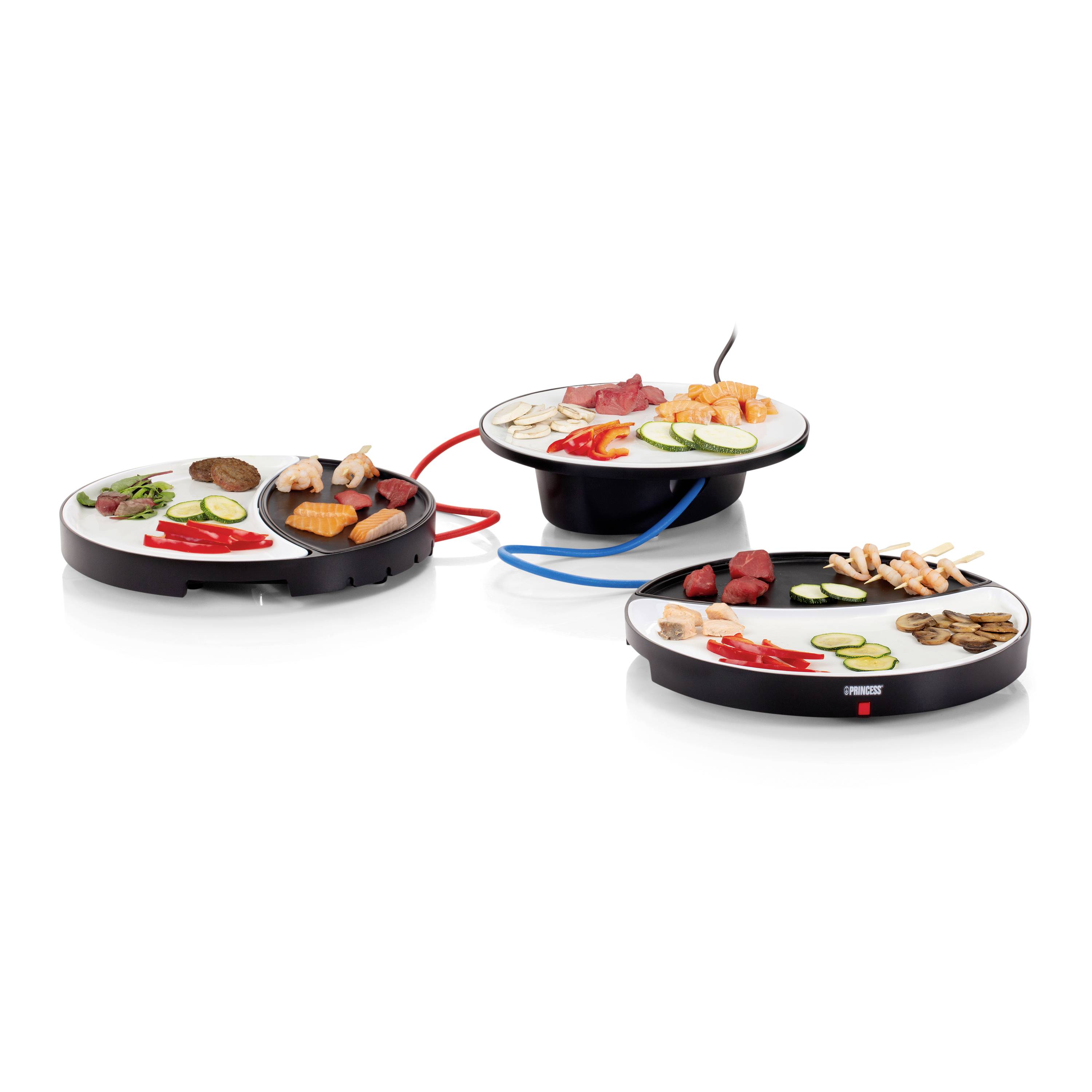 Three round electric tabletop grills with assorted meats, vegetables, and seafood displayed on white background.