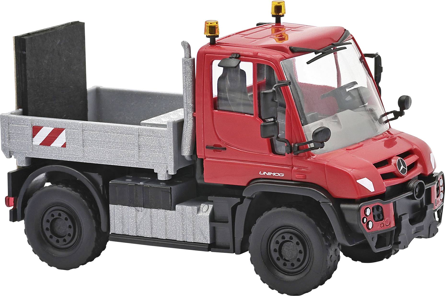 Red toy dump truck with a red cab, gray cargo bed, black wheels, and warning lights on top, shown on a white background.