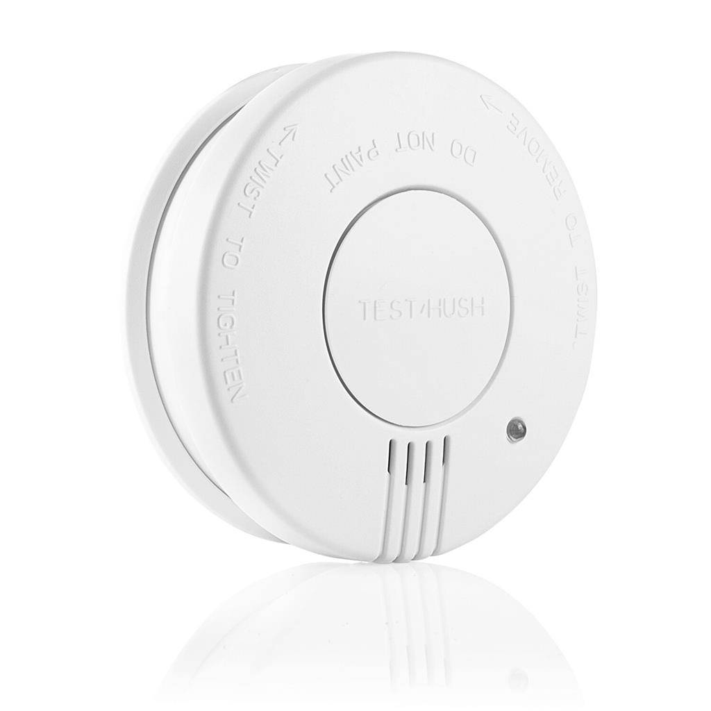 White round smoke detector with central 'TEST/HUSH' button and 'PUSH TO TIGHTEN' text on a plain white background.