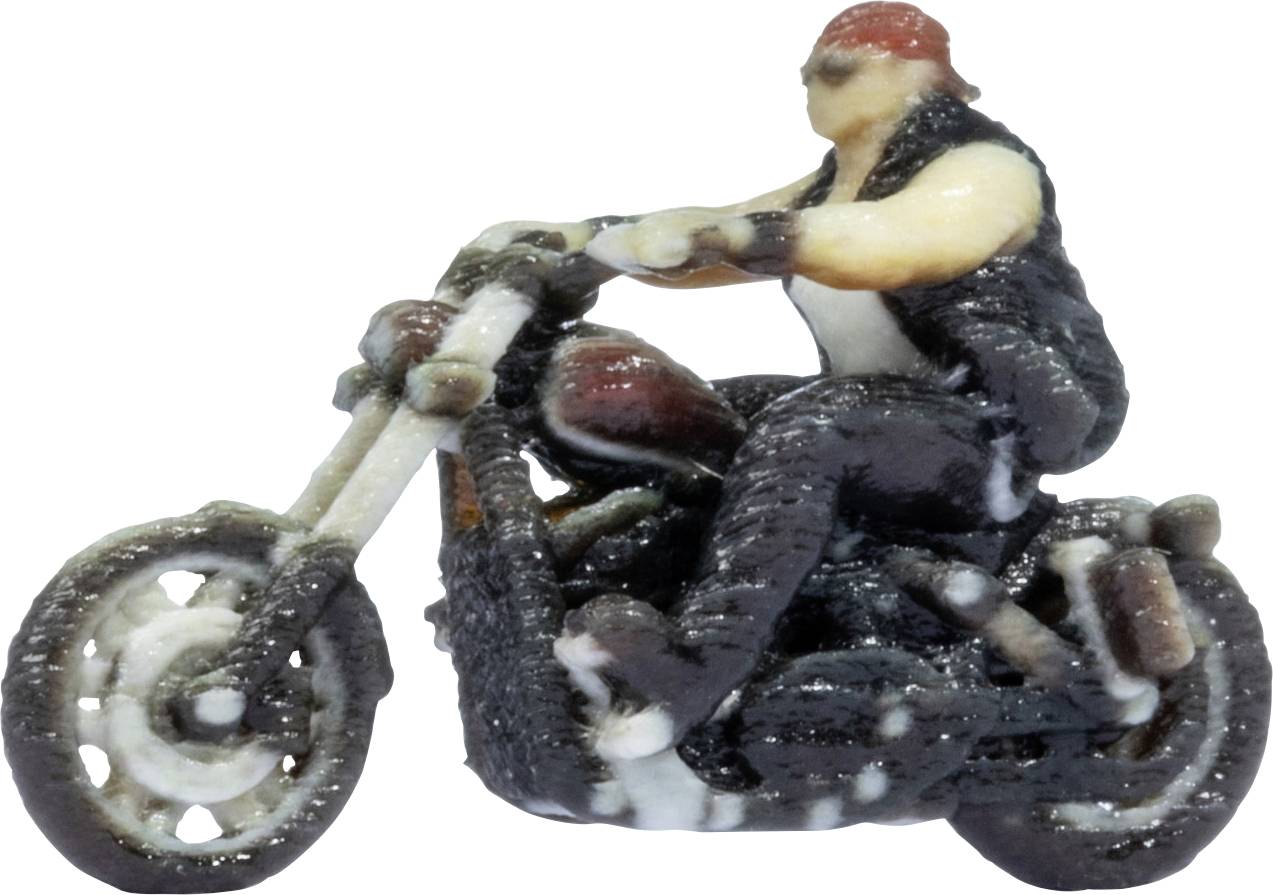 Small figurine of a person riding a motorcycle, shown in profile on a white background.