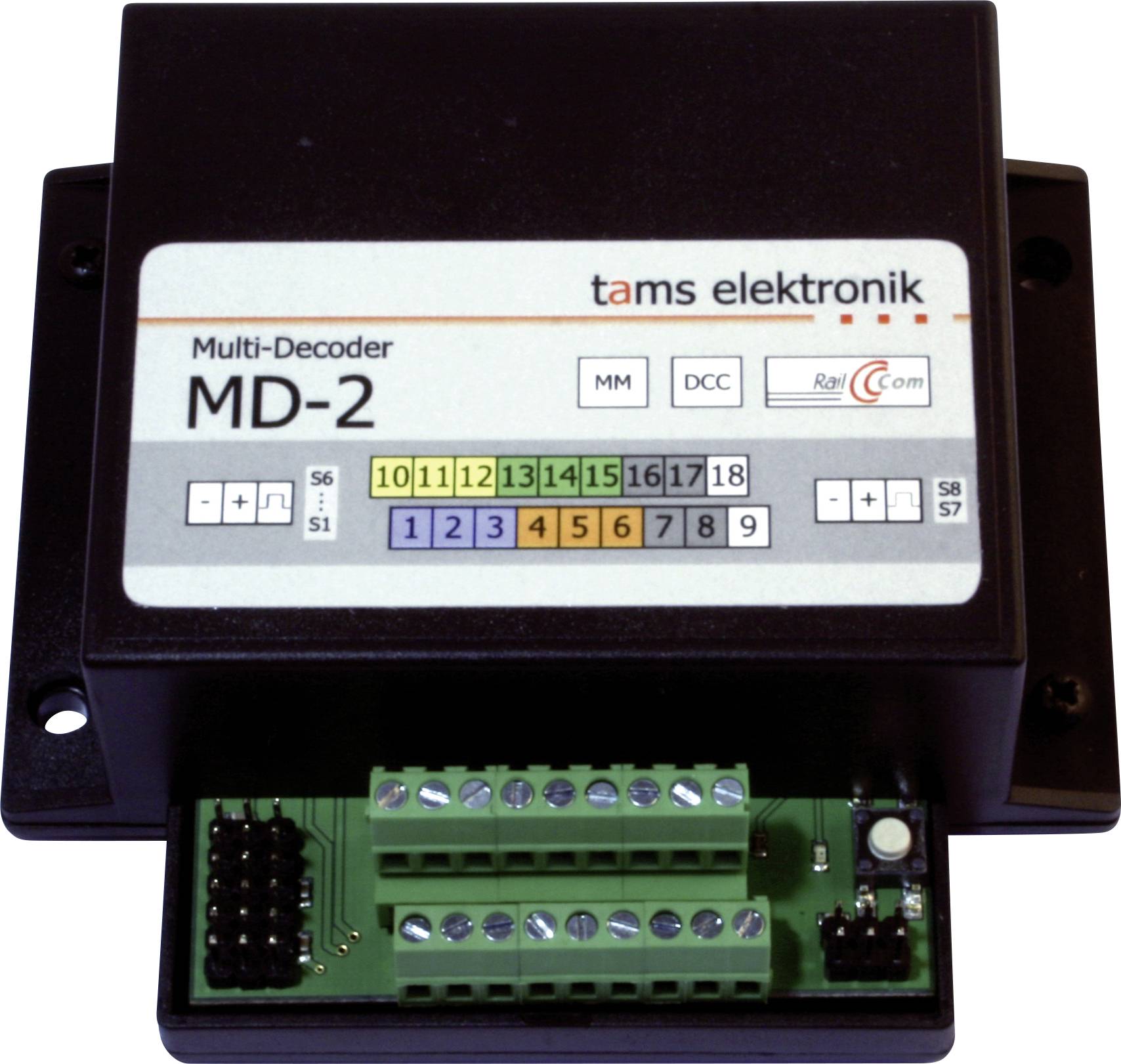 Black Tams Elektronik MD-2 multi-decoder module with labeled switches, numbered channels 1-18, and green screw-terminal connectors.