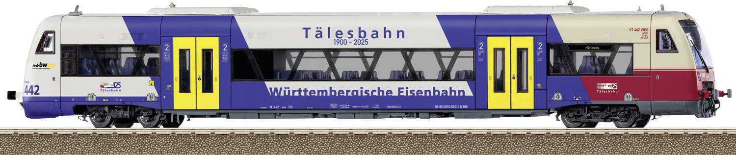 Side view of a blue and white passenger train with yellow doors, labeled Tålesbahn and Württembergische Eisenbahn, numbered 142.