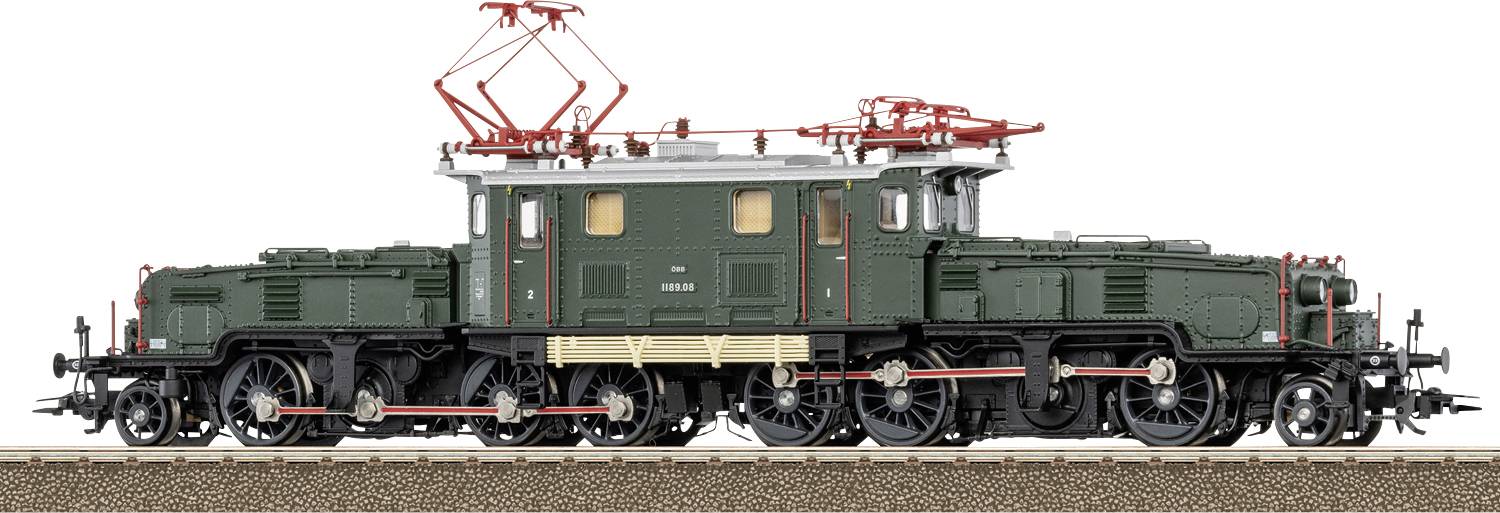 Side view of a green vintage electric locomotive with red roof equipment on tracks against a white background.