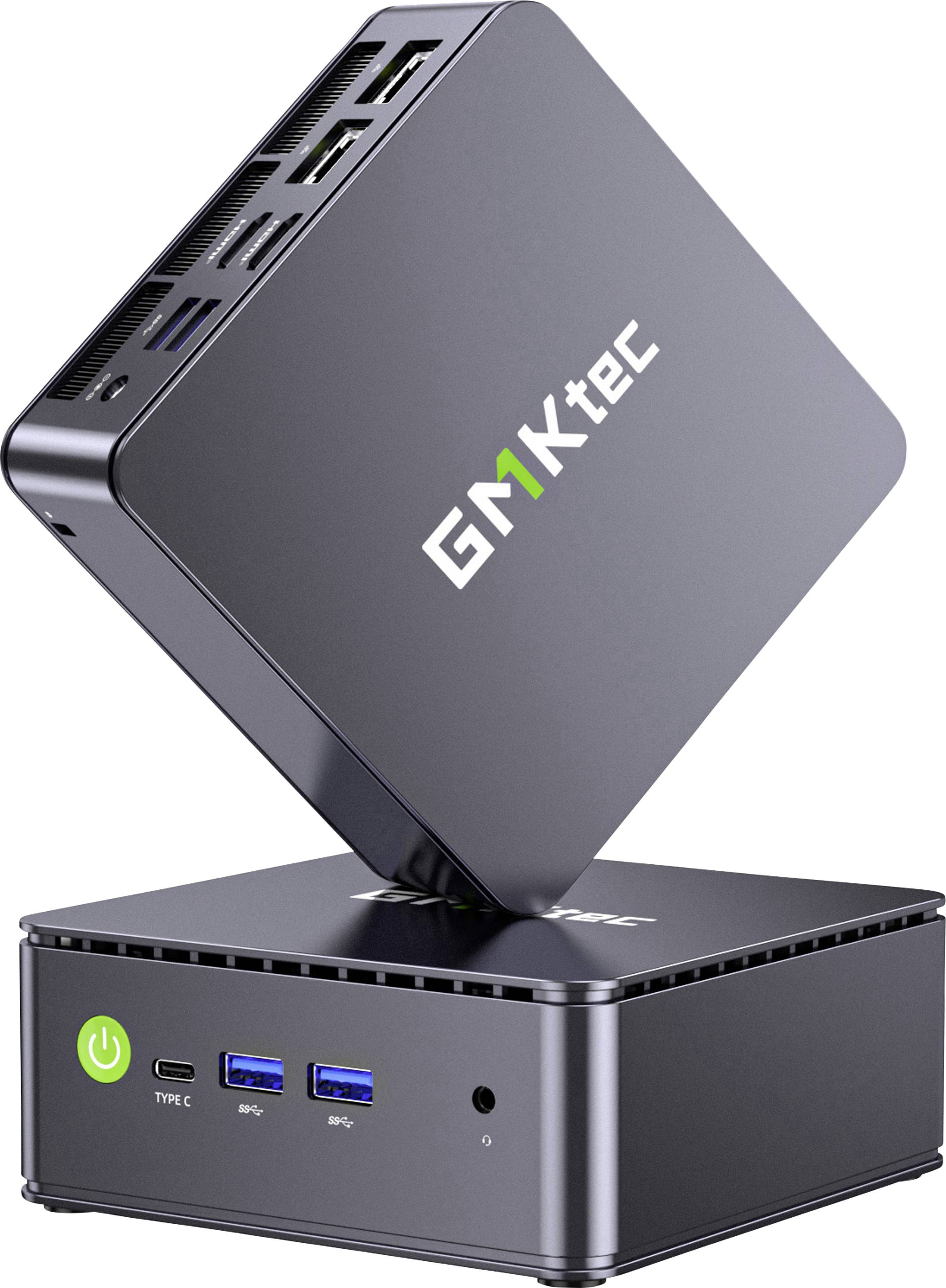 A compact GEEKTEC mini PC shown open on its stand, with front ports including power, USB-C, two USB-A, and audio jack.